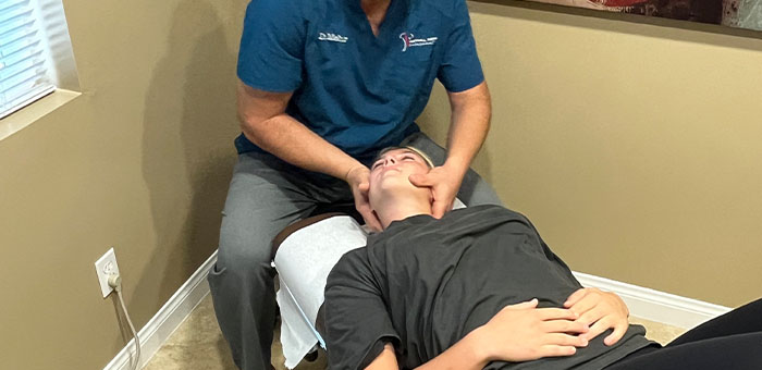 patient receiving diversified technique in La Verne for auto accident injury