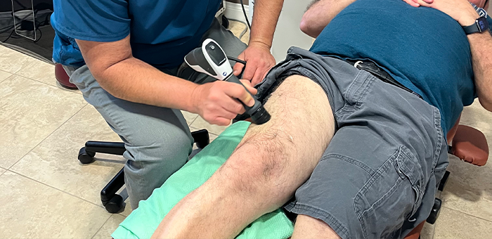 patient receiving shockwave therapy in La Verne for auto accident injury