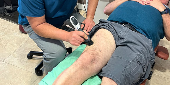 patient getting shockwave therapy in La Verne for auto accident injury